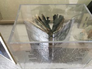 Burned handmade book inside a UV-Mini Helmet display case by BALLQUBE.com